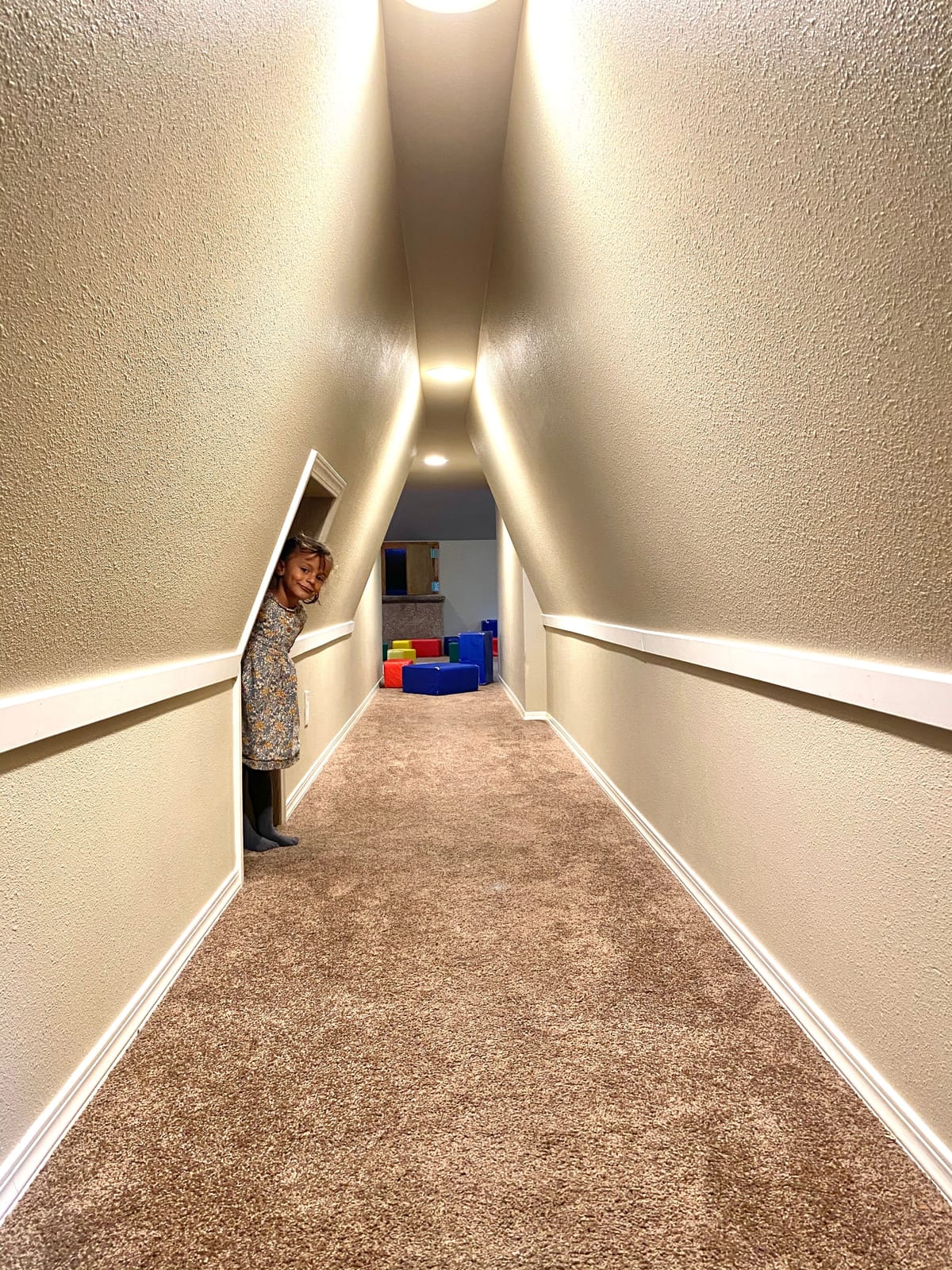 A child peeking from a secret passage