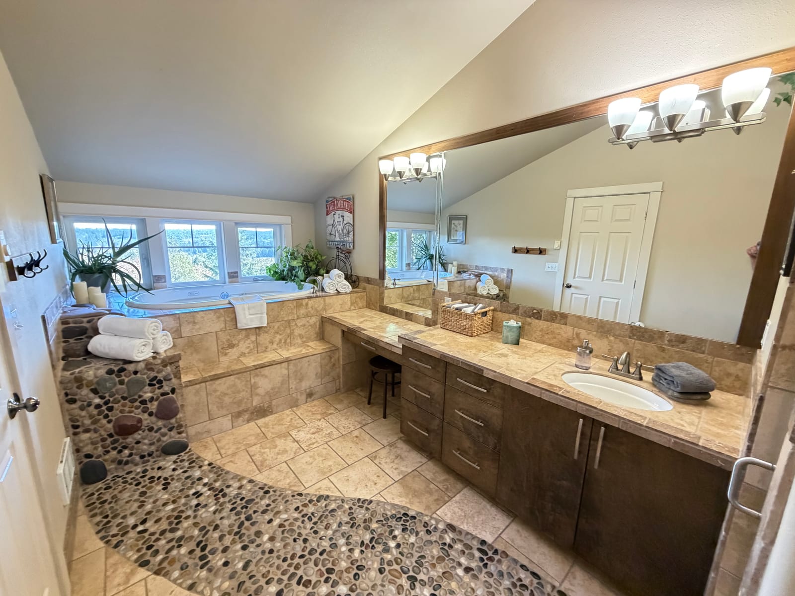 Upper ensuite with soaking tub and valley windows