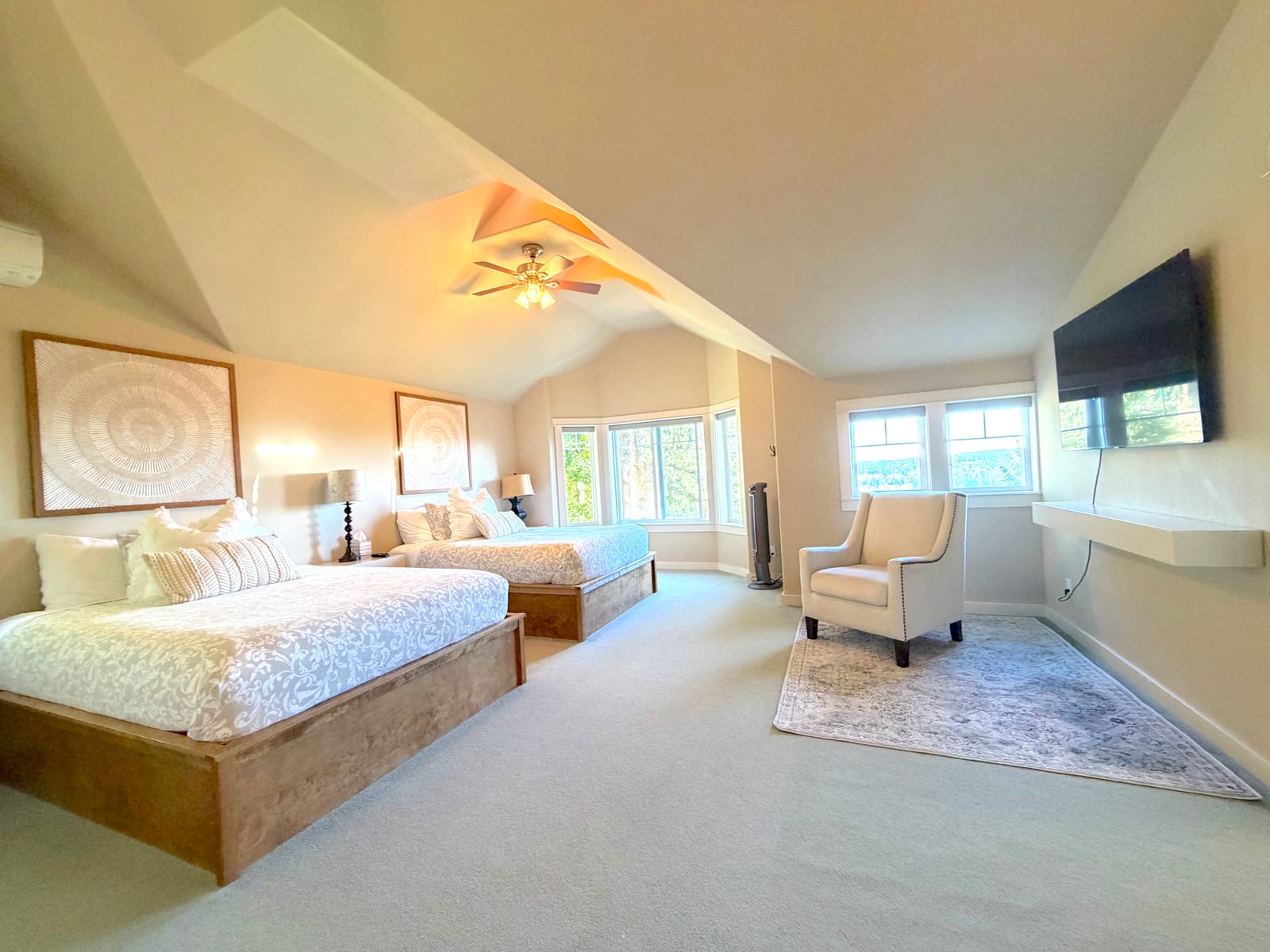 Quiet upper bedroom with a chair by the windows