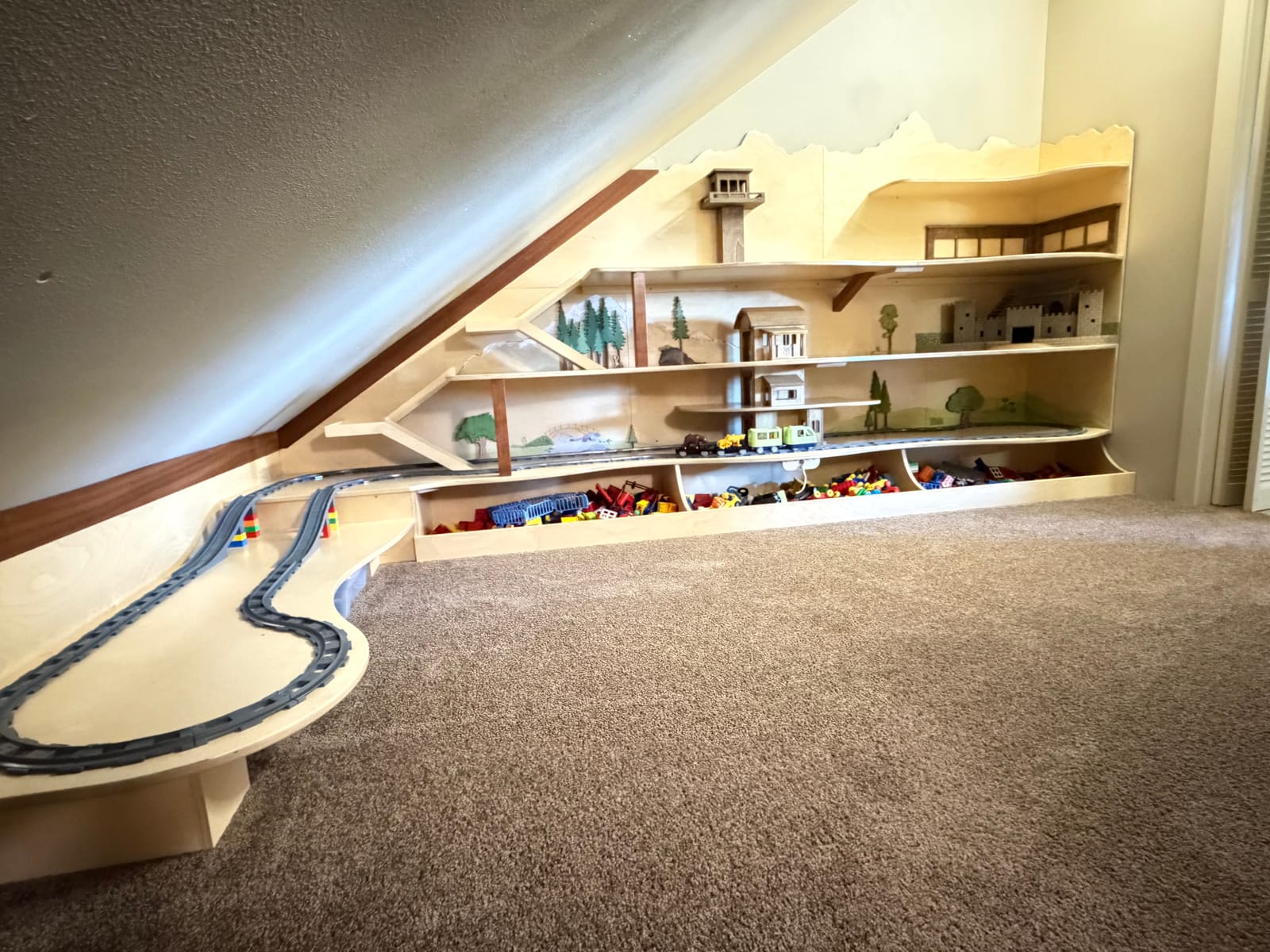 LEGO and train table on the upper level