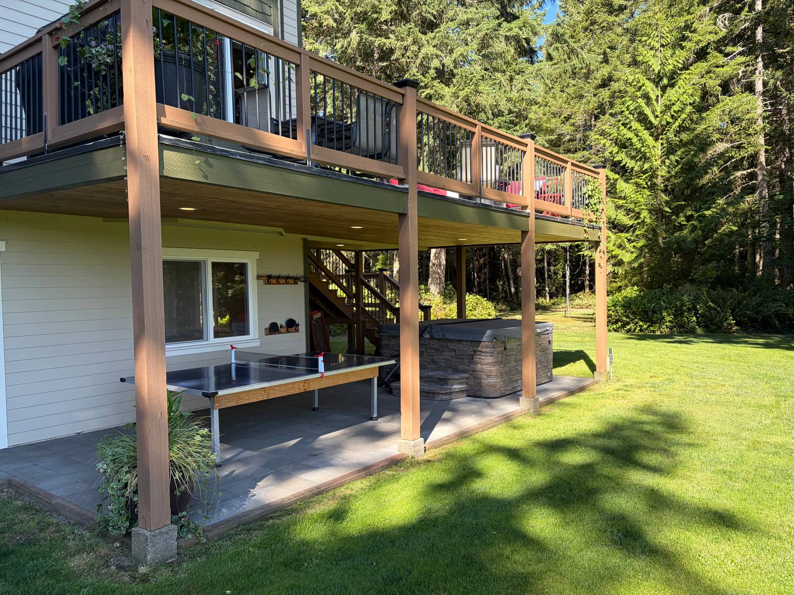 Ping-pong and the jacuzzi under the deck